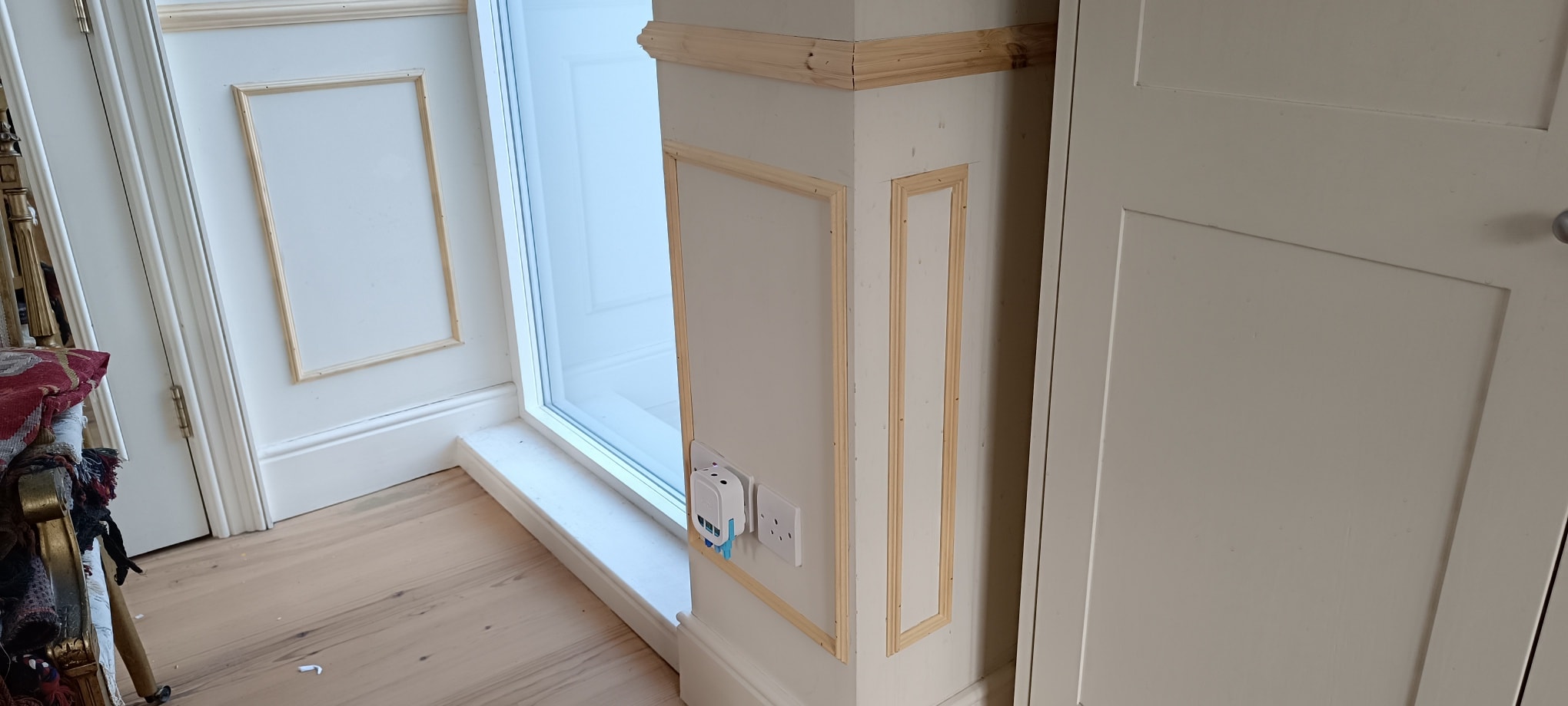 Detailed picture frame moulding around window